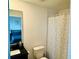Bathroom featuring a modern vanity, toilet, and patterned shower curtain at 3428 Tranquil Trail, Kissimmee, FL 34747