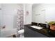 Cozy bathroom with a shower-tub combination, neutral color palette, and vanity with a granite countertop at 3428 Tranquil Trail, Kissimmee, FL 34747