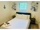 Inviting bedroom with natural light, neutral decor, and comfortable queen-size bed at 3428 Tranquil Trail, Kissimmee, FL 34747