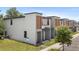 Side view of modern townhomes in a well-maintained community, offering a comfortable and stylish living experience at 3428 Tranquil Trail, Kissimmee, FL 34747