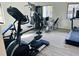 Well-equipped gym with various exercise machines and natural light, designed for a complete workout experience at 3428 Tranquil Trail, Kissimmee, FL 34747