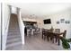 Open-concept space with dining area and kitchen, featuring modern finishes and an inviting atmosphere at 3428 Tranquil Trail, Kissimmee, FL 34747
