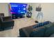 Relaxing living room with comfortable seating, large screen television, and neutral carpeting at 3428 Tranquil Trail, Kissimmee, FL 34747