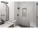 Modern bathroom featuring updated vanity, and tiled shower with window at 4116 Winona Dr, Orlando, FL 32812