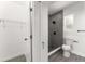 Neatly organized walk-in closet with wire shelving and a view into the stylish, renovated bathroom at 4116 Winona Dr, Orlando, FL 32812