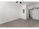 Bright bedroom featuring gray tile floors, and ceiling fan at 4116 Winona Dr, Orlando, FL 32812