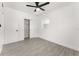 Bedroom with a closet, ceiling fan, and wood-look tile flooring at 4116 Winona Dr, Orlando, FL 32812