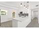 Bright, updated kitchen with white cabinets, quartz countertops, and stainless steel appliances at 4116 Winona Dr, Orlando, FL 32812