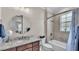 Bathroom featuring granite countertops, bathtub, and modern fixtures at 7890 Lake James Blvd, Lakeland, FL 33810