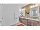 Bright bathroom with double vanity, granite countertops, and modern fixtures at 7890 Lake James Blvd, Lakeland, FL 33810