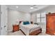 Cozy bedroom with natural light, plantation shutters, and wooden furniture at 7890 Lake James Blvd, Lakeland, FL 33810