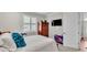 Bedroom with large window, hardwood floors, and ample space at 7890 Lake James Blvd, Lakeland, FL 33810