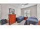 Comfortable bedroom with twin beds, natural light, and matching furniture at 7890 Lake James Blvd, Lakeland, FL 33810