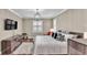 Bedroom featuring hardwood floors, neutral walls, plantation shutters and a ceiling fan at 7890 Lake James Blvd, Lakeland, FL 33810