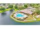 Aerial view of community pool area with lounge chairs and landscaping at 7890 Lake James Blvd, Lakeland, FL 33810