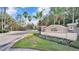 Lake James entrance sign with palm trees, flowers and gated entry at 7890 Lake James Blvd, Lakeland, FL 33810