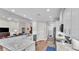 Open kitchen flows into living area with stainless steel appliances and granite countertops at 7890 Lake James Blvd, Lakeland, FL 33810