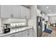 White cabinets and granite countertops feature in this well-lit kitchen with stainless appliances at 7890 Lake James Blvd, Lakeland, FL 33810