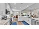 Kitchen showcasing granite counters, breakfast nook, stainless appliances, and outside dining area at 7890 Lake James Blvd, Lakeland, FL 33810