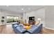 Spacious living room with a plush sectional sofa, hardwood floors, and a cozy atmosphere at 7890 Lake James Blvd, Lakeland, FL 33810