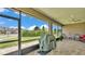Enjoy outdoor living on this screened patio with ceiling fan and beautiful views of the manicured lawn at 7890 Lake James Blvd, Lakeland, FL 33810