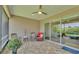 Relaxing screened-in porch with comfortable seating and outdoor views at 7890 Lake James Blvd, Lakeland, FL 33810
