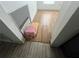 Damaged wood flooring needs repair, with missing pieces and a step stool is present at 801 Quintilian Ave, Orlando, FL 32809