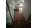 Hallway with hardwood floors, window and doorway at 801 Quintilian Ave, Orlando, FL 32809