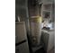 Hot water heater is visible in a cluttered utility area, next to a washing machine and shelves at 801 Quintilian Ave, Orlando, FL 32809