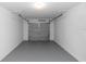 A clean and organized garage space with pegboard walls and ample storage capacity at 1161 Orangewood Ave, Deland, FL 32724