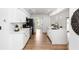 This kitchen has a center island, shaker cabinets, stainless appliances, and a white subway tile backsplash at 1161 Orangewood Ave, Deland, FL 32724