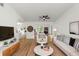Bright living room featuring hardwood floors, fresh white paint, and tasteful contemporary decor at 1161 Orangewood Ave, Deland, FL 32724