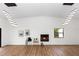 Bright and airy living room with a modern fireplace and sleek lighting fixtures at 1161 Orangewood Ave, Deland, FL 32724