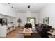 Stylish living room with high ceilings, an eat-in island, and lots of natural light at 1161 Orangewood Ave, Deland, FL 32724