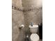 Updated bathroom featuring modern toilet and tile surround at 2220 Woods Trl, Lakeland, FL 33809