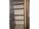 Open closet featuring multiple built in shelves at 2220 Woods Trl, Lakeland, FL 33809