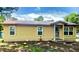 Cozy one-story home with a red roof, showing potential and charm at 2220 Woods Trl, Lakeland, FL 33809