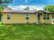 Quaint single-story home with a red roof, awaiting your personal touch at 2220 Woods Trl, Lakeland, FL 33809