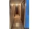 Hallway featuring tile flooring and closet at 2220 Woods Trl, Lakeland, FL 33809