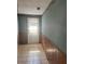 Entryway hall features tiling, wood paneling, and a window at 2220 Woods Trl, Lakeland, FL 33809