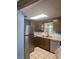 Functional kitchen with stainless steel appliances, ample counter space and tiled floor at 2220 Woods Trl, Lakeland, FL 33809