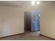 View of the living room leading to a light blue bonus room at 2220 Woods Trl, Lakeland, FL 33809