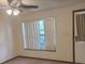 Living room featuring a ceiling fan and natural light at 2220 Woods Trl, Lakeland, FL 33809