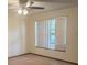 Living room featuring a ceiling fan and natural light at 2220 Woods Trl, Lakeland, FL 33809