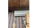 Exterior porch showing stacked construction materials and weathered wood floorboards at 2220 Woods Trl, Lakeland, FL 33809