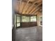 Inviting screened-in porch with wood plank ceiling, and ceiling fan, perfect for enjoying the outdoors at 2220 Woods Trl, Lakeland, FL 33809