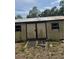 A backyard shed with a weathered exterior offers ample storage at 2220 Woods Trl, Lakeland, FL 33809