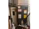 Water heater and air conditioning unit inside the utility room at 2220 Woods Trl, Lakeland, FL 33809