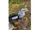 Exterior well pump for water supply, shown among foliage and debris at 2220 Woods Trl, Lakeland, FL 33809