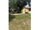 Side yard and ample parking with mature trees at 2220 Woods Trl, Lakeland, FL 33809